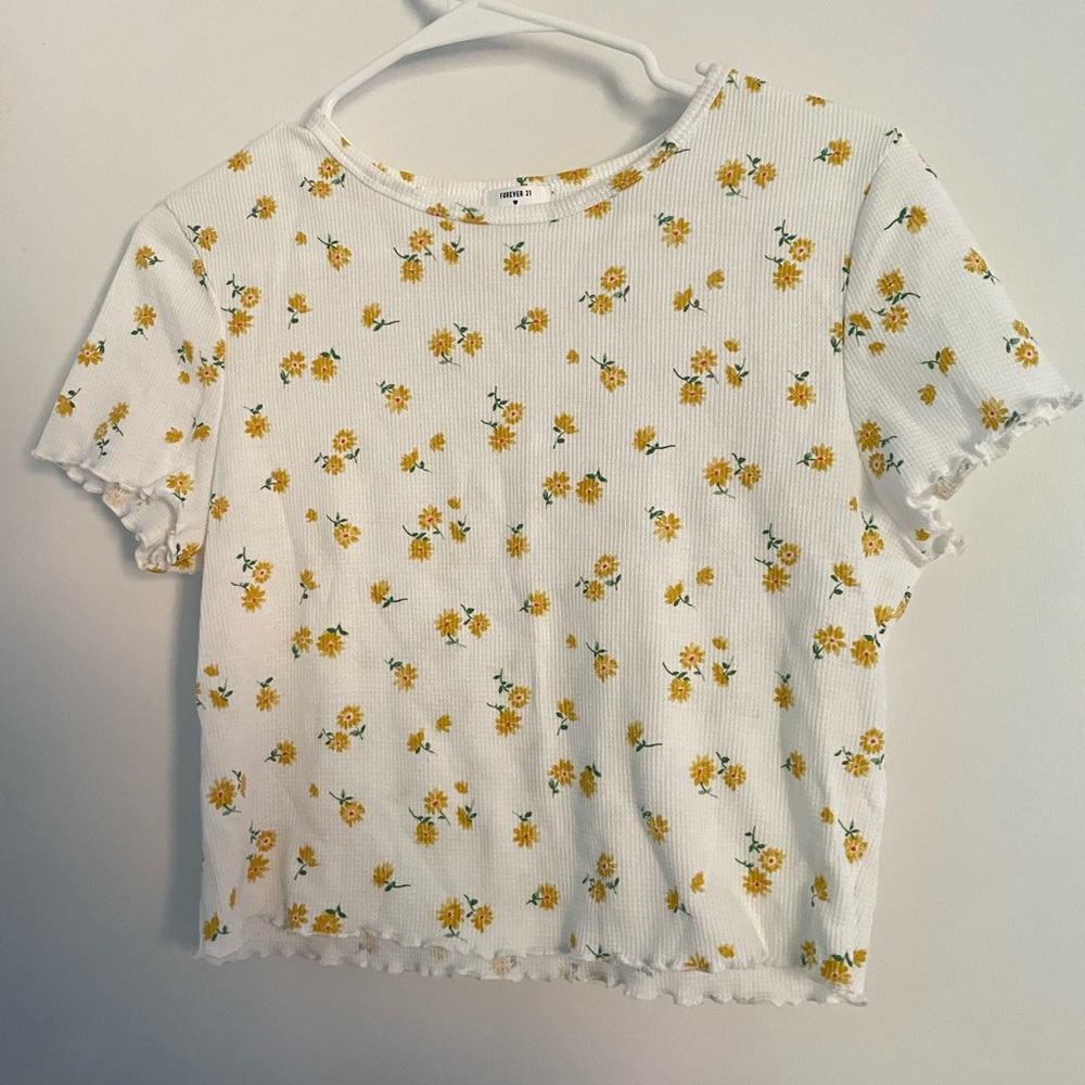 This is a white patterned crop top. It is from forever 21 and is a size medium